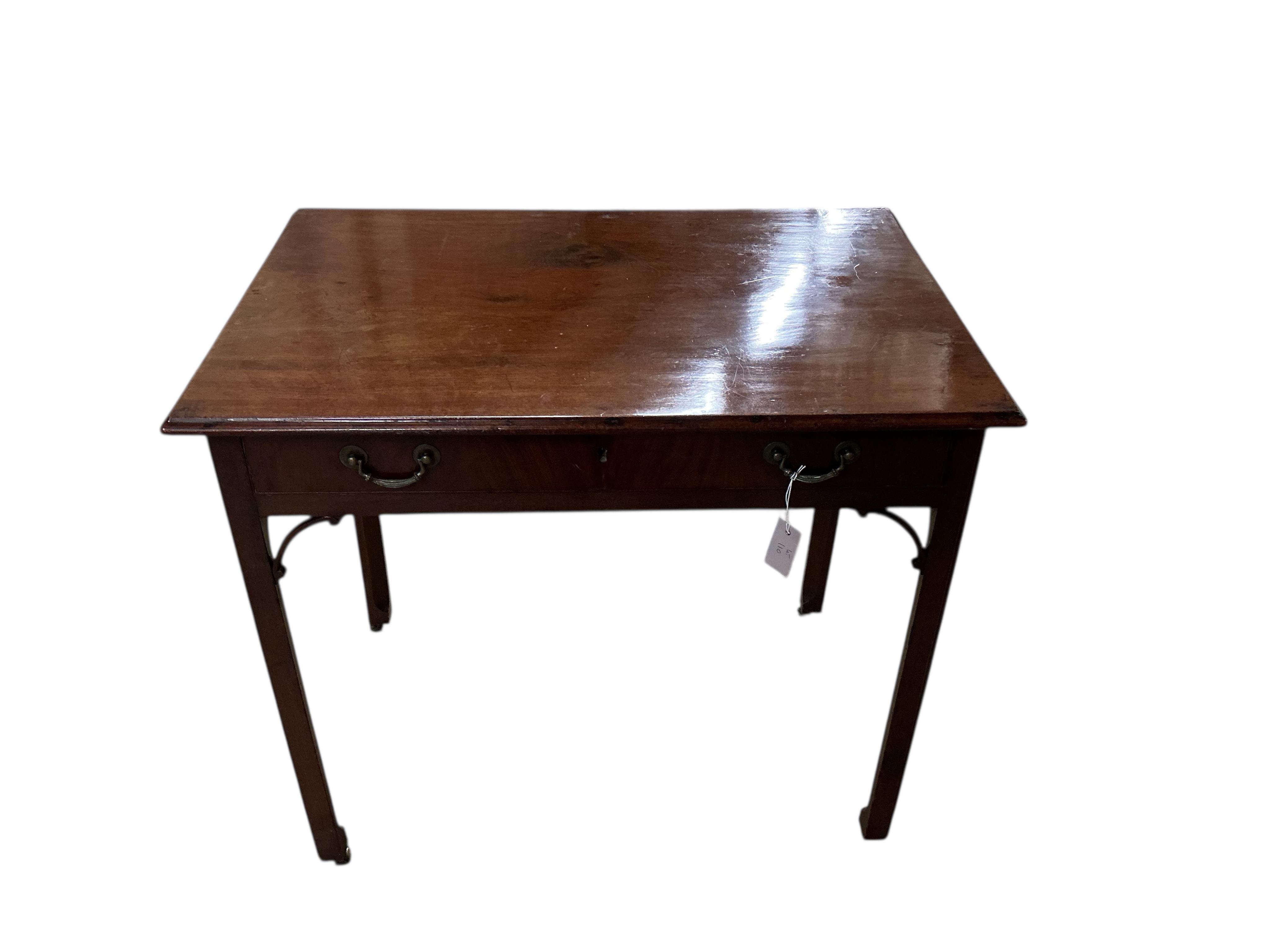 A George III mahogany serving table on chamfered square legs, width 91cm, depth 61cm, height 79cm.